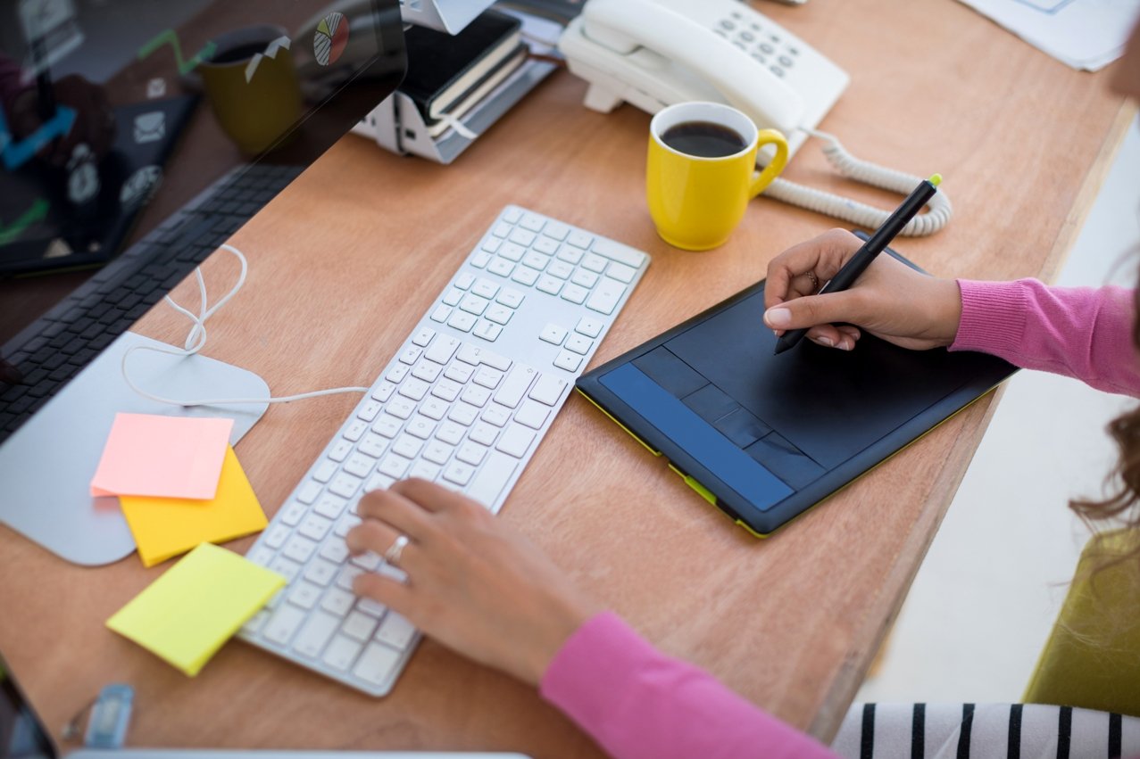 female graphic designer working at desk V73HFQ5 1 Appstycoon